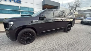 Black limo car parked for airport transfer